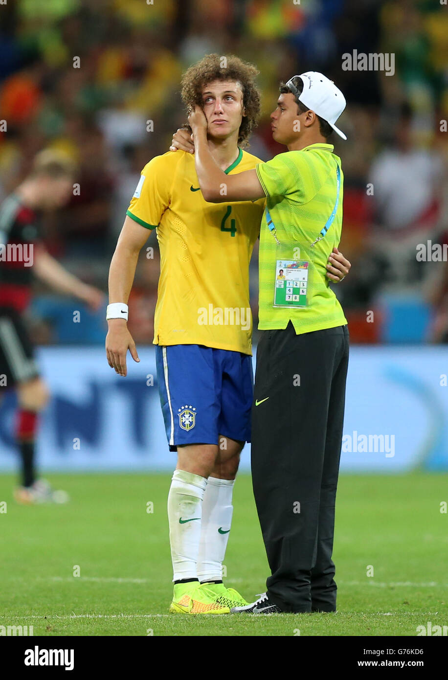 Brazil's David Luis (left) has to be consoled by teammate Thiago Silva (right) as he shows emotion after the final whistle during the FIFA World Cup Semi Final at Estadio Mineirao, Belo Horizonte, Brazil. Stock Photo