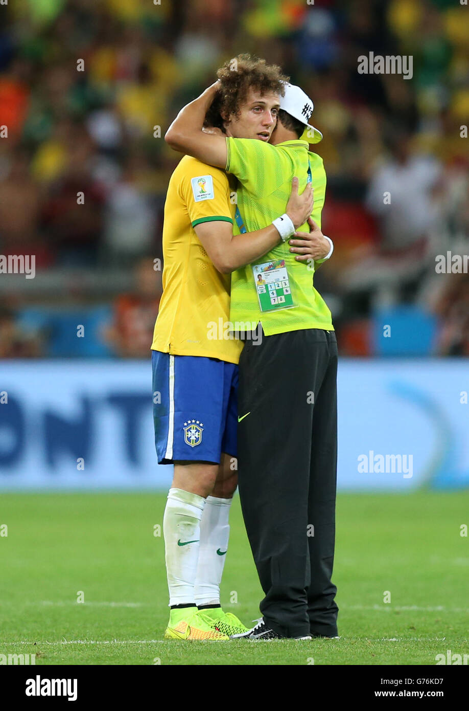 Brazil's David Luis (left) has to be consoled by teammate Thiago Silva (right) as he shows emotion after the final whistle during the FIFA World Cup Semi Final at Estadio Mineirao, Belo Horizonte, Brazil. Stock Photo