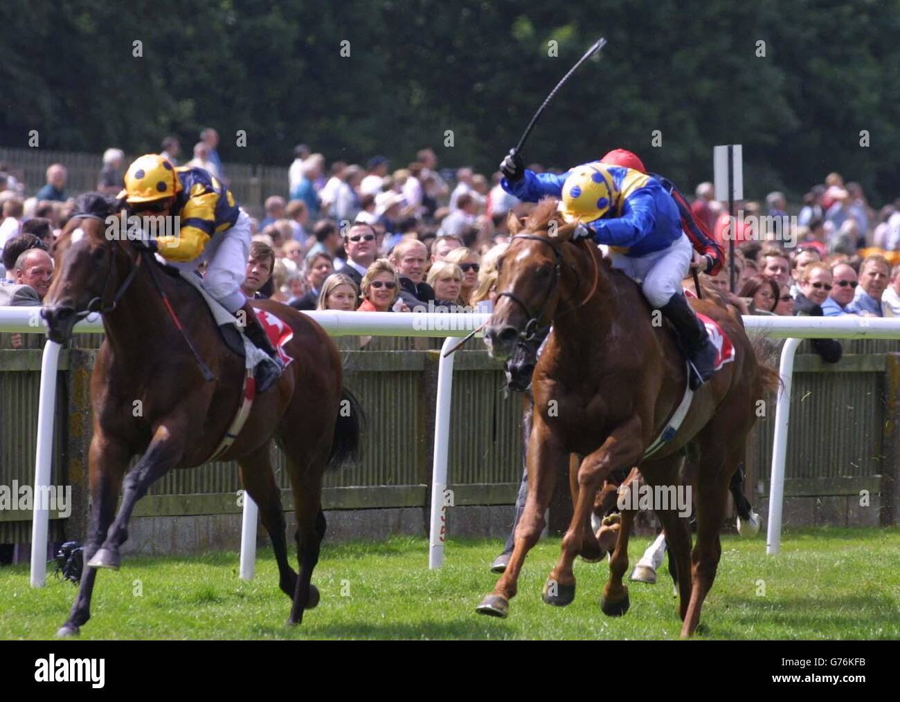 Atavus (left) ridden by Jamie Mackay beats the Jimmy Fortune ridden King of Happiness to win the Antec International Criterion Stakes at Newmarket. Stock Photo