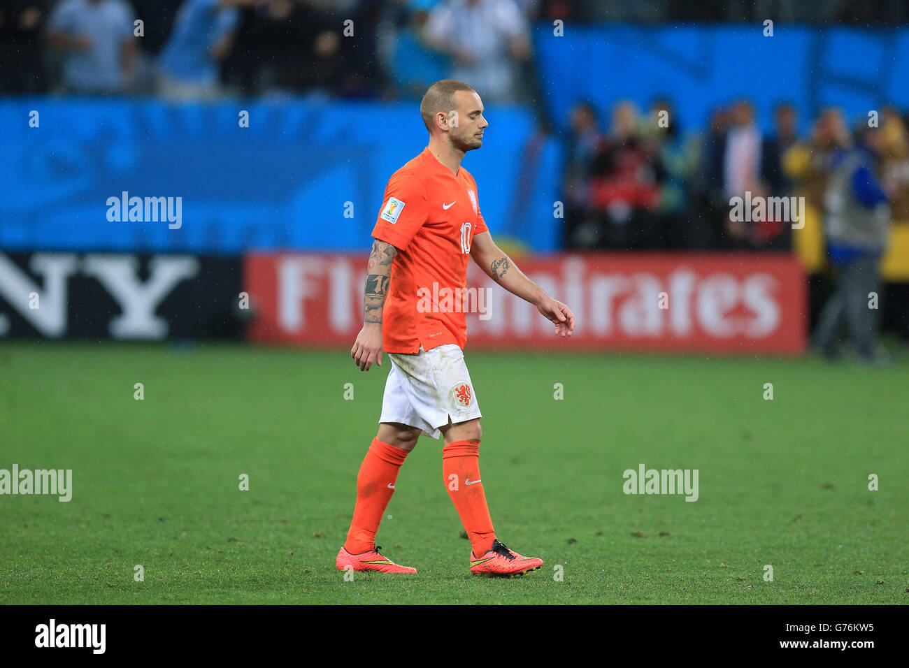 Netherlands' Wesley Sneijder is left dejected after missing a penalty in the shoot-out during the FIFA World Cup Semi Final at the Arena de Sao Paulo, Sao Paulo, Brazil. PRESS ASSOCIATION Photo. Picture date: Wednesday July 9, 2014. See PA story SOCCER Holland. Photo credit should read: Mike Egerton/PA Wire. RESTRICTIONS: . No commercial use. No use with any unofficial 3rd party logos. No manipulation of images. No video emulation Stock Photo