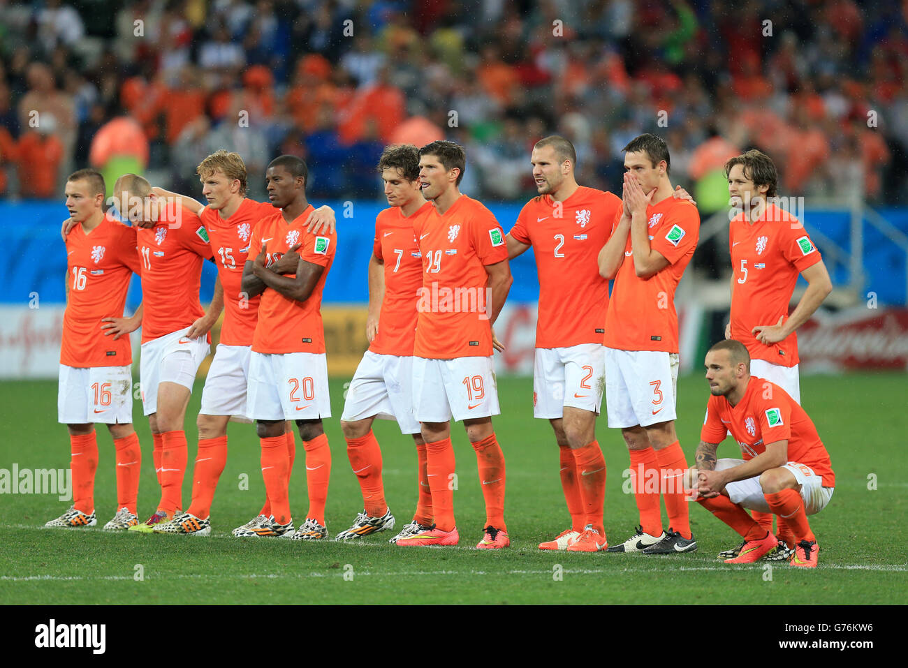 Netherlands players appear dejected in the penalty shoot-out during the FIFA World Cup Semi Final at the Arena de Sao Paulo, Sao Paulo, Brazil. PRESS ASSOCIATION Photo. Picture date: Wednesday July 9, 2014. See PA story SOCCER Holland. Photo credit should read: Mike Egerton/PA Wire. RESTRICTIONS: No commercial use. No use with any unofficial 3rd party logos. No manipulation of images. No video emulation Stock Photo