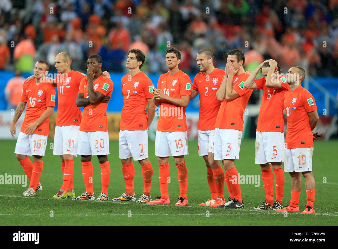 Netherlands players appear dejected in the penalty shoot-out during the FIFA World Cup Semi Final at the Arena de Sao Paulo, Sao Paulo, Brazil. PRESS ASSOCIATION Photo. Picture date: Wednesday July 9, 2014. See PA story SOCCER Holland. Photo credit should read: Mike Egerton/PA Wire. RESTRICTIONS: Editorial use only. No commercial use. No use with any unofficial 3rd party logos. No manipulation of images. No video emulation Stock Photo