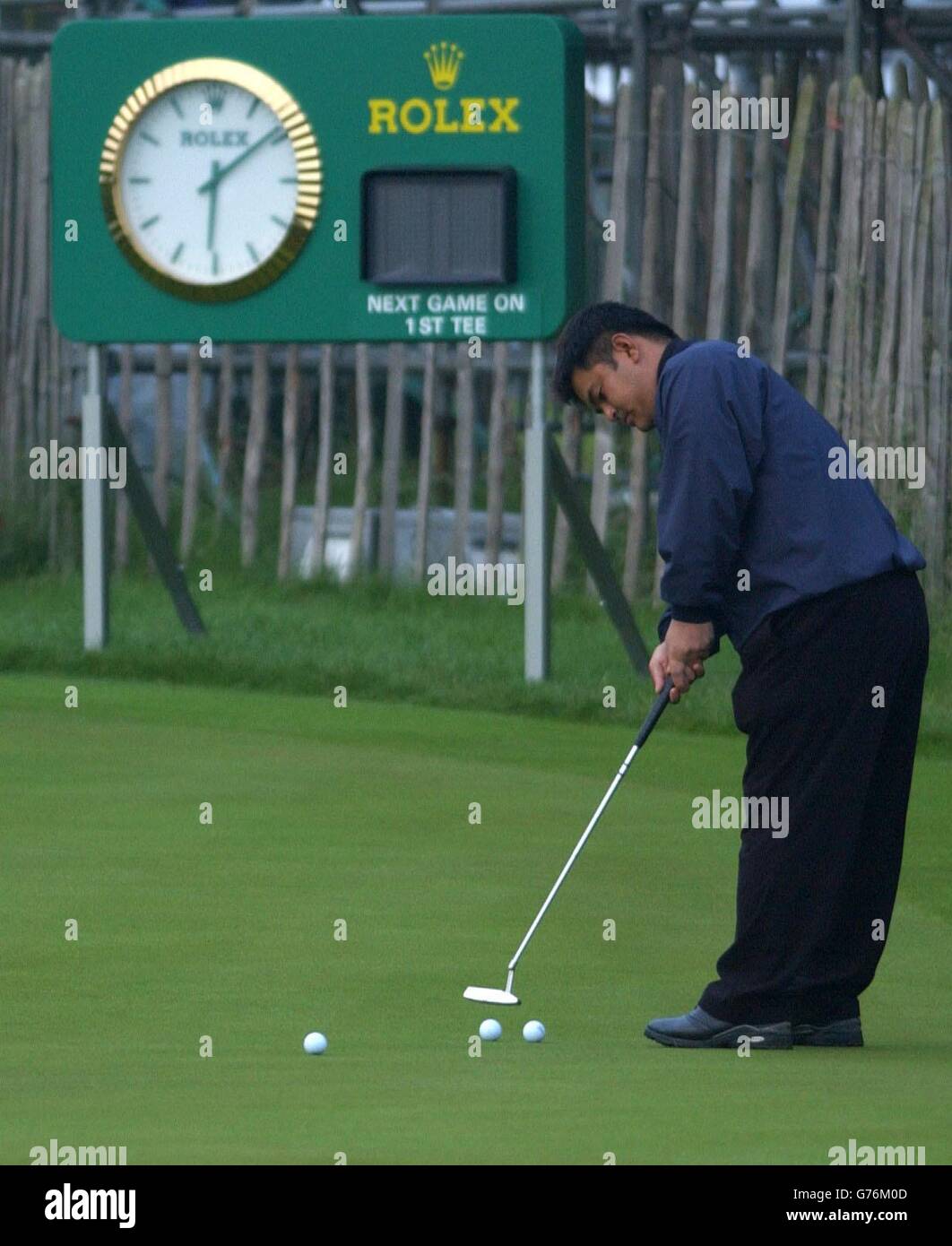 Japanese golfer Kiyoshi Miyazato practises his putting before the first round of the 131st Open Championship, Muirfield, Scotland. Stock Photo