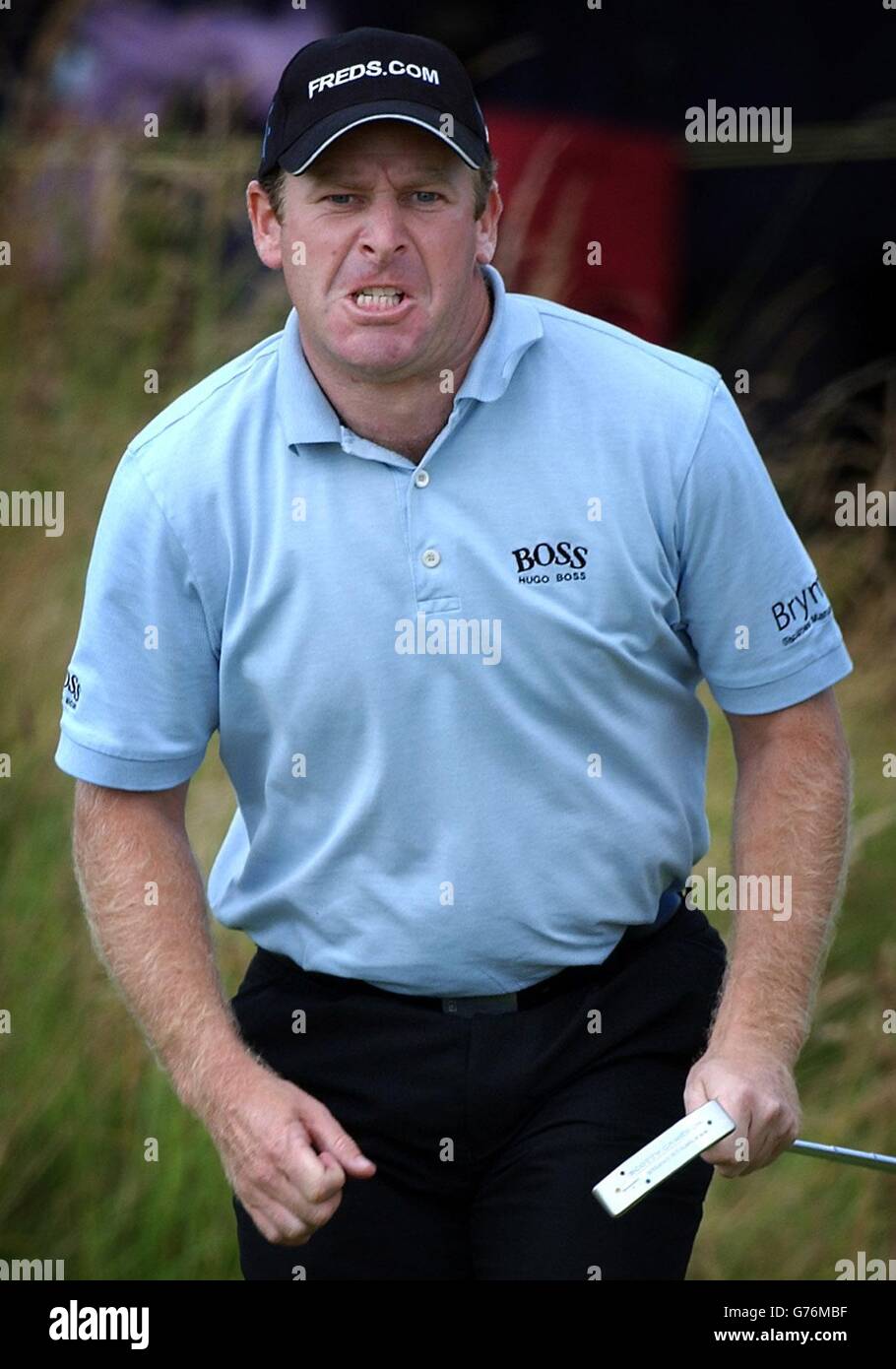 Gary Evans celebrates making a par putt after losing his ball on the 17th hole, during the final day of the 131st Open Championship at Muirfield, Scotland. Stock Photo