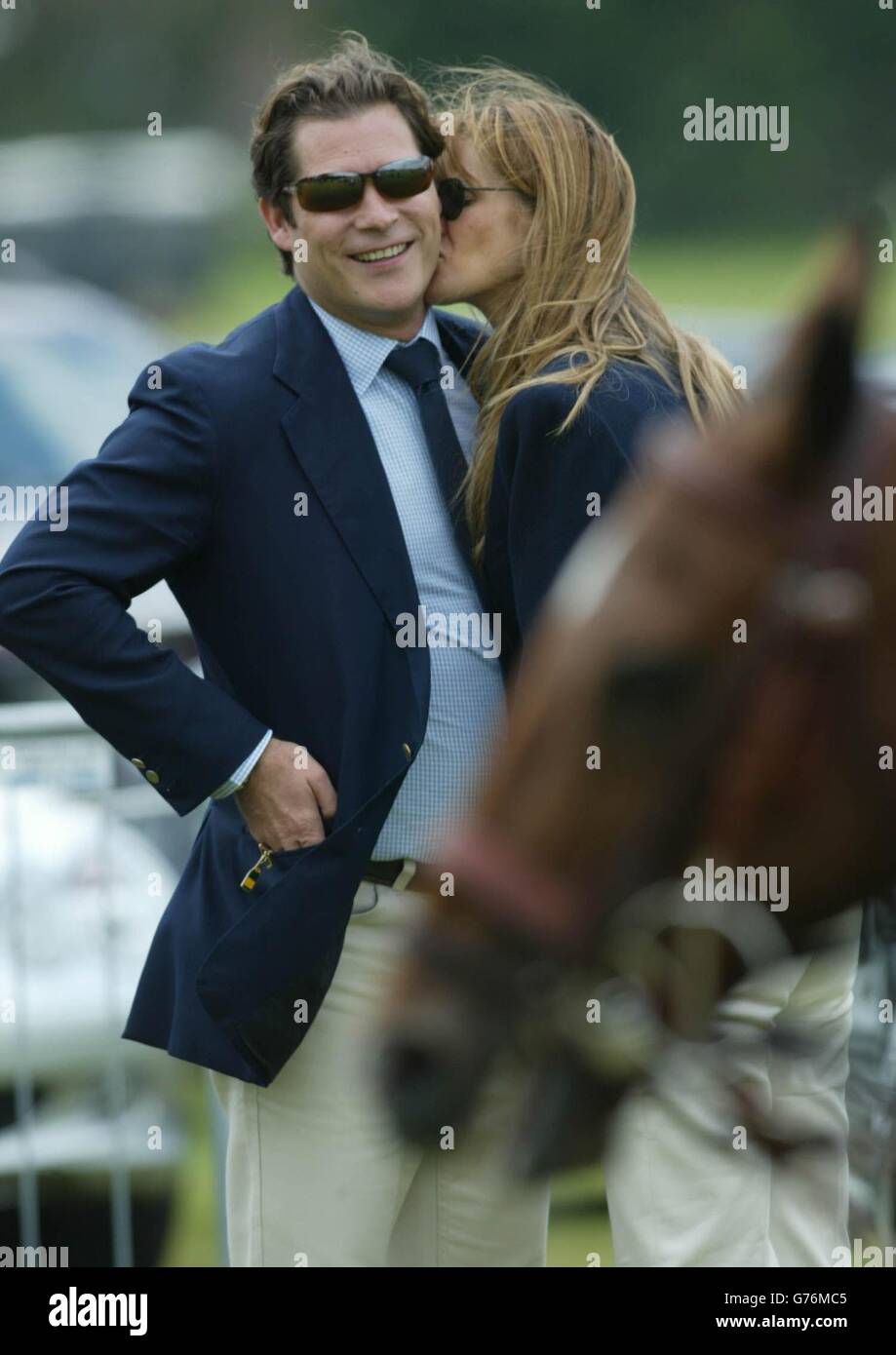 Supermodel Elle Macpherson with her partner, French financier Arpad 'Arki' Busson, at the final of the Veuve Clicquot Polo Gold Cup at Cowdray Park at Midhurst, West Sussex. Stock Photo
