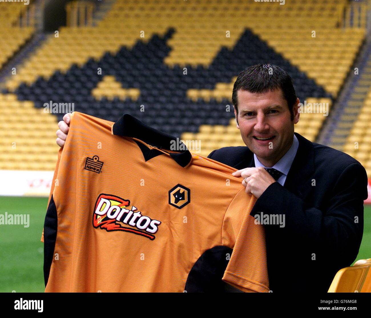 Denis Irwin holds his new Wolverhampton Wanderers shirt, at the Molineux Stadium, Wolverhampton, after the former Manchester United defender's free transfer. . Stock Photo