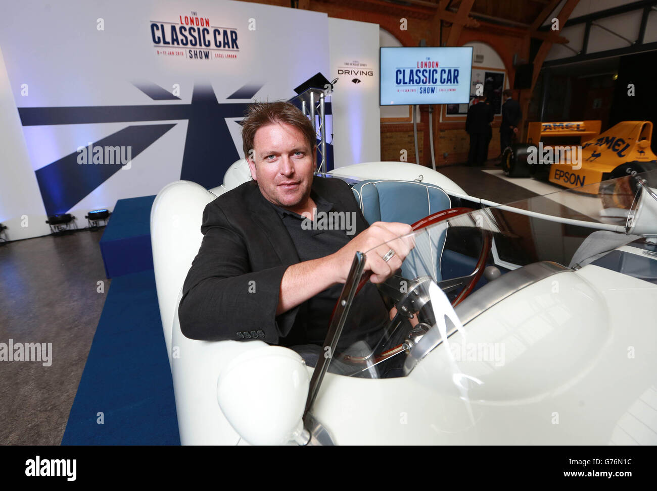 Television chef James Martin with a 1957 Ferrari TR250 during the launch of the inaugural London Classic Car Show, which will take place at ExCeL between 8th to 11th January 2015, in Kensington, London. Stock Photo