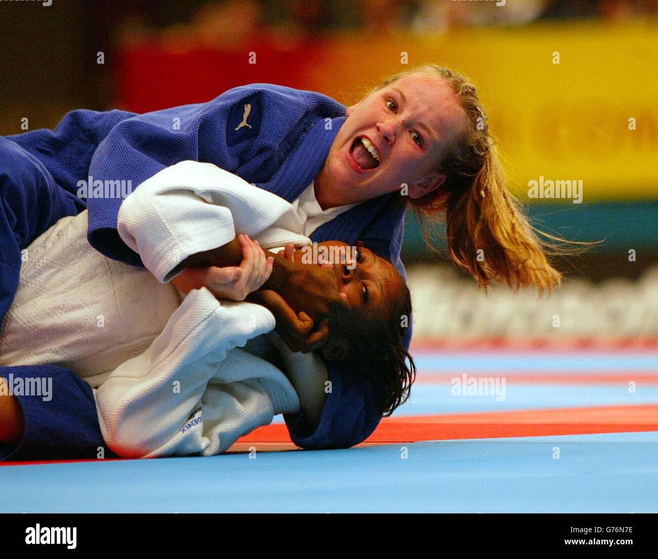 England's Clare Lynch claims victory over Nigeria's Alice Livinus during the Commonwealth Games women's 48 kg Judo competition in Manchester. Stock Photo