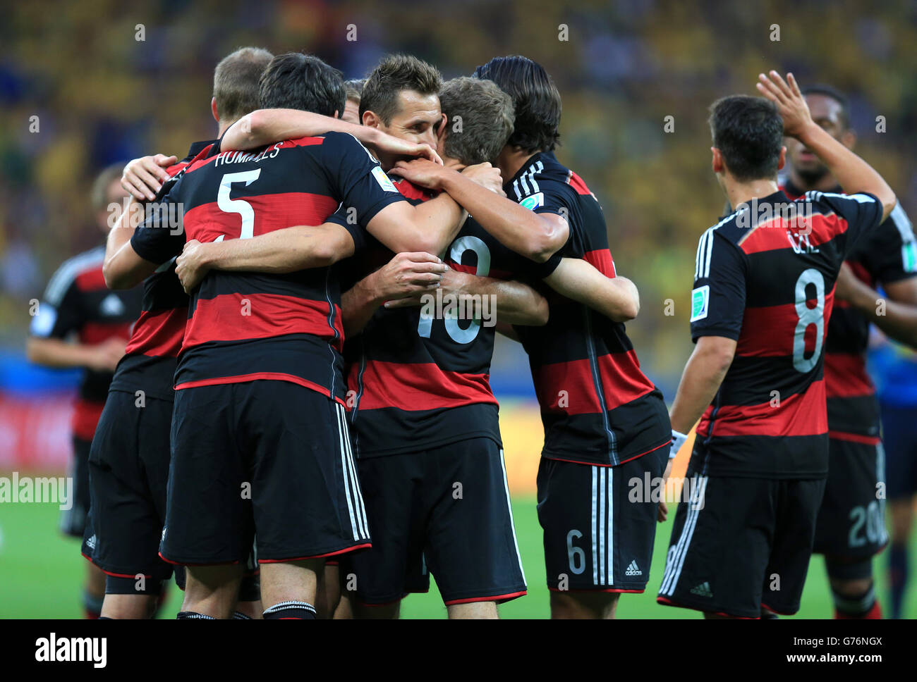 Germany's Miroslav Klose (left) celebrates scoring his side's second goal of the game with teammates during the FIFA World Cup Semi Final at Estadio Mineirao, Belo Horizonte, Brazil. Stock Photo