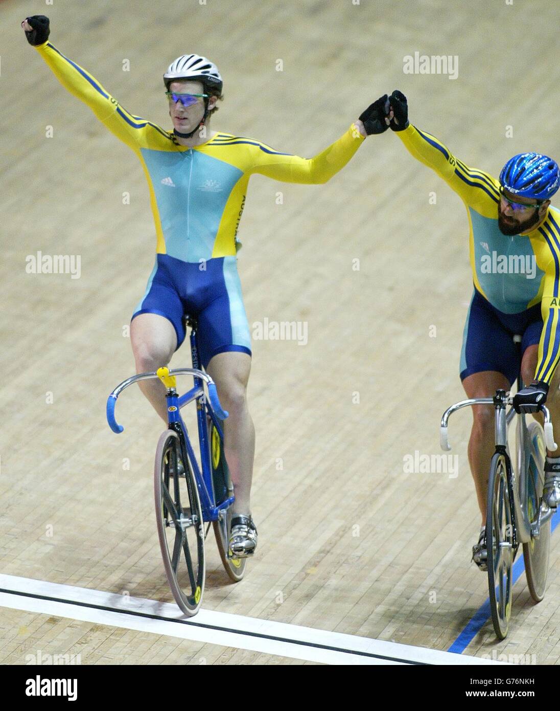 Australia's Ryan Bayley (L) celebrates taking Gold with Sean Eadie (R) finishing with Silver, in Commonwealth Games Mens Sprint, at The Velodrome in Manchester. Stock Photo