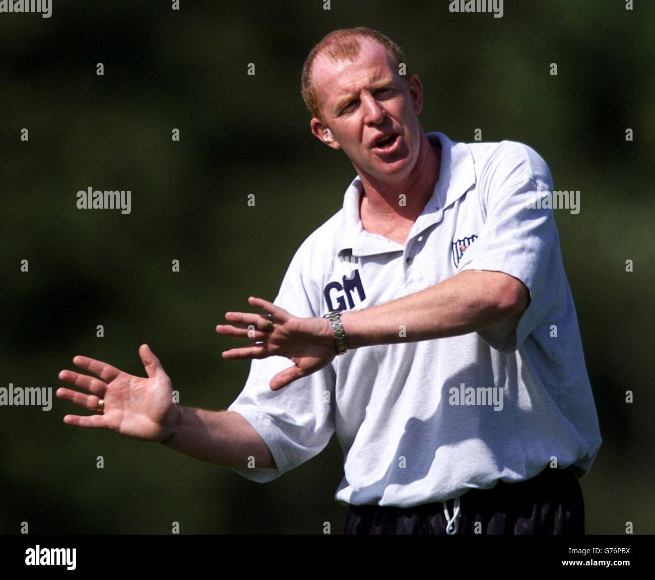 West Bromwich Albion Manager Gary Megson watches his players in training prior to their opening game in the Premiership against Manchester United on Saturday at Old Trafford, Aston University Sports Ground, Birmingham. Stock Photo