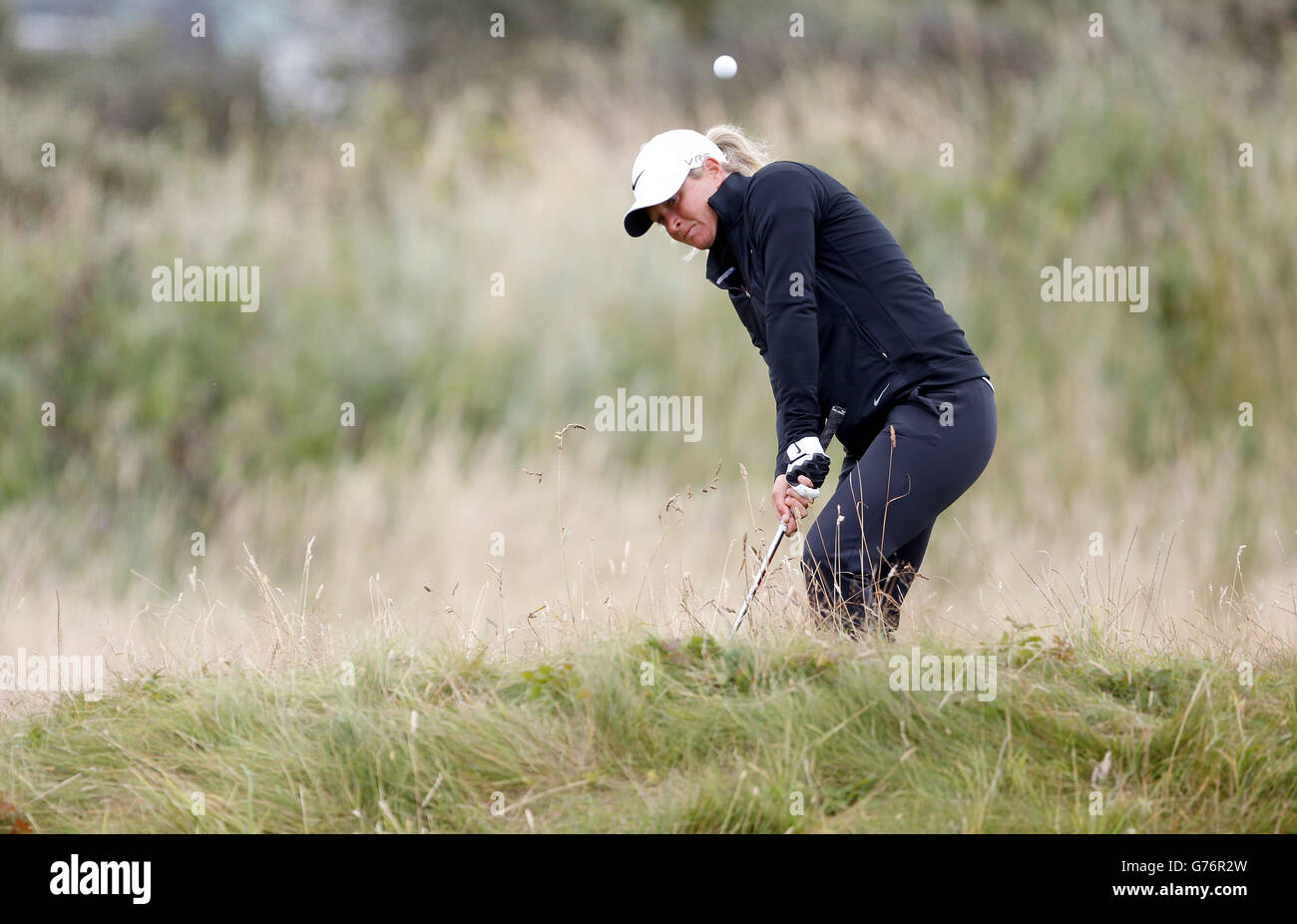 Suzann Pettersen of Norway, plays out of the rough on the 1st hole during day four of the Ricoh Women's British Open at Royal Birkdale, Southport. Stock Photo