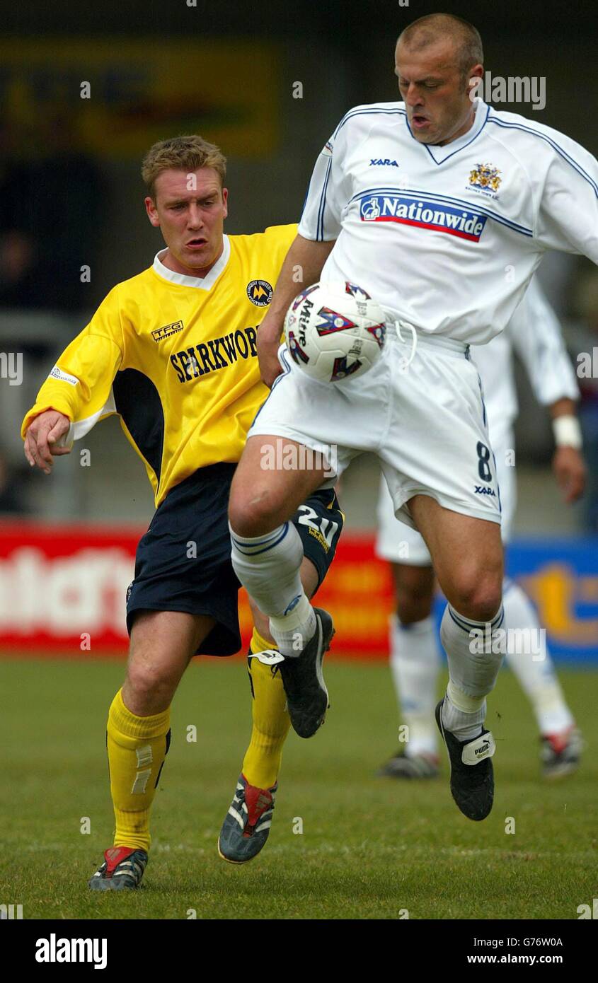 Halifax's player manager Neil Redfearn controls the ball away from Torquays David Graham during the Nationwide League Division Three match at Torquay's Plainmoor Ground. NO UNOFFICIAL CLUB WEBSITE USE. Stock Photo