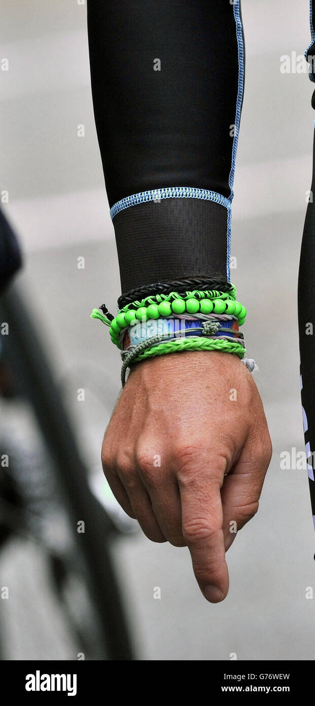 Omega Pharma - Quick-Step's Mark Cavendish wearing a green beaded bracelet  as he waits to start his training session on the Tour de France route ahead of  the Grand Depart on Saturday