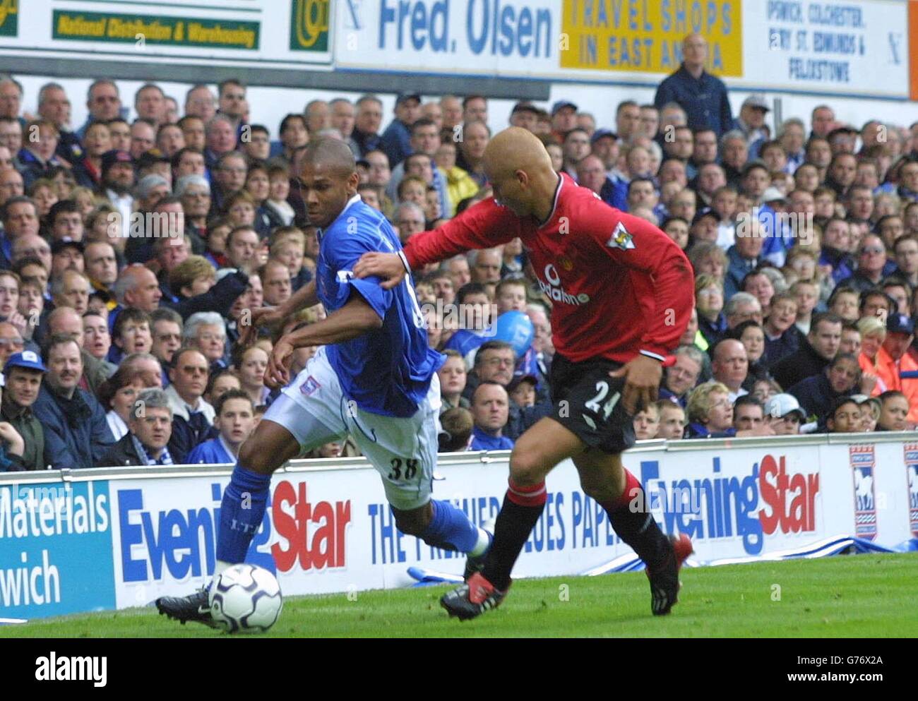 Ipswich Town's Marcus Bent (left) comes under pressure from Manchester United's Wes Brown, during their FA Barclaycard Premiership match at Portman Road. Stock Photo