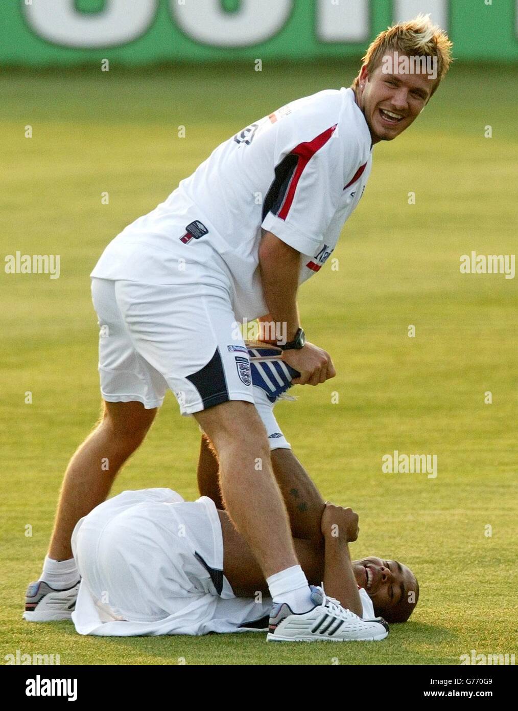 England captain David Beckham and Ashley Cole warm down at training in Awaji, Japan, following their team's 3-0 victory over Denmark in their second round World Cup game. Stock Photo