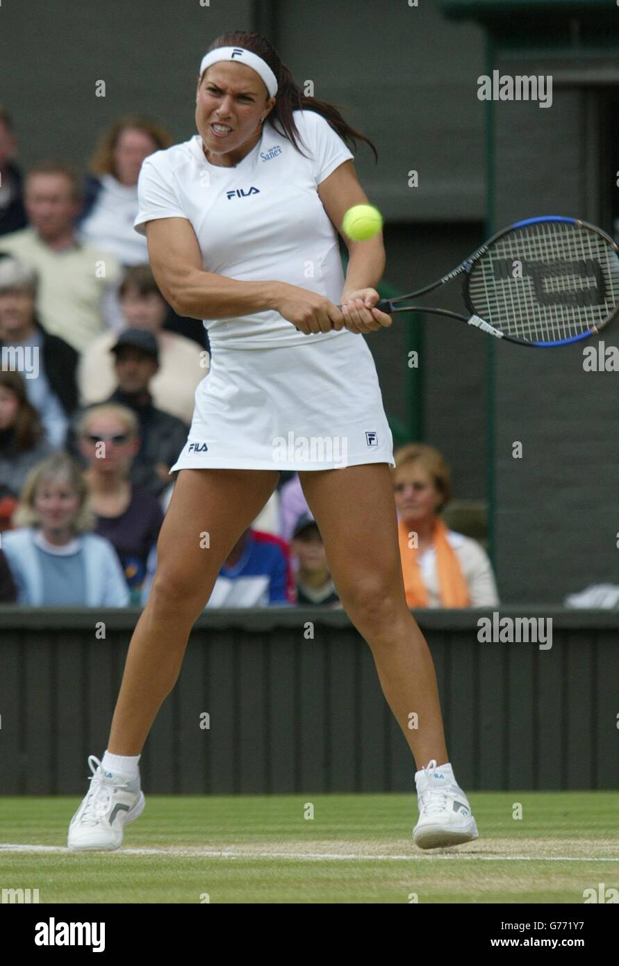 Jennifer Capriati, the 3rd seed from the USA in action against Amelie Mauresmo of France, the 9th seed on Centre Court at Wimbledon. Stock Photo