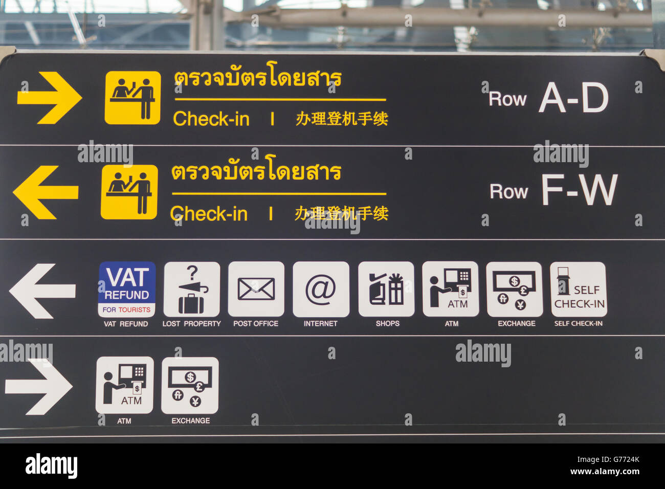 Check-in counter signs at departure terminal in international airport Stock Photo