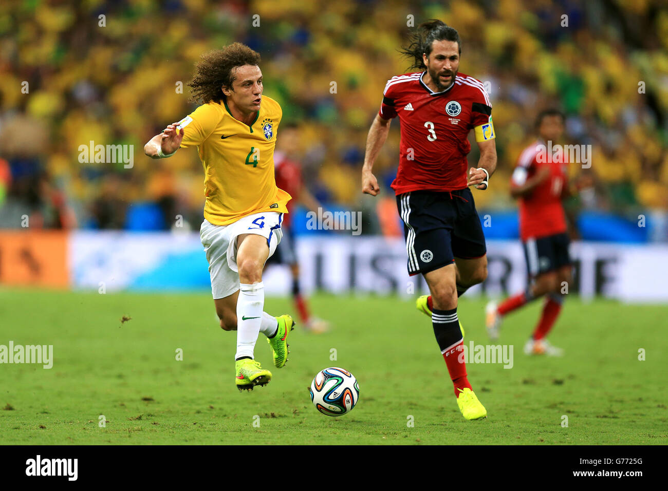 Soccer - FIFA World Cup 2014 - Quarter Final - Brazil v Colombia - Estadio Castelao. Brazil's David Luiz battles for the ball with Colombia's Carlos Valdes Stock Photo
