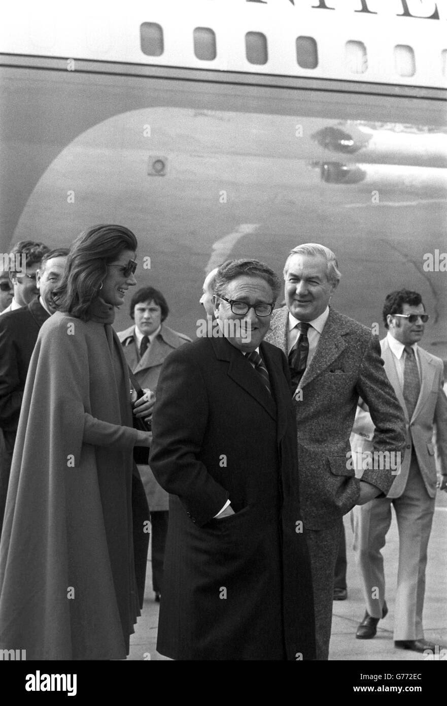 U.S Secretary of State Dr Henry Kissinger and his wife Nancy, escorted by Foreign Secretary Mr James Callaghan (right) walk to the Kissingers' aircraft at Heathrow airport this afternoon. Dr Kissinger, en route to Washington from his abortive efforts to reach an interim peace agreement in the Middle East, had talks with Mr Callaghan in the Queens Lounge at the airport. Stock Photo