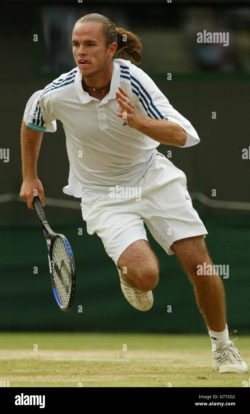 Xavier Malisse from Belgium charges to the net before defeating Richard  Krajicek from Holland in the mens' quarter final match on Court One at  Wimbledon. Malisse fought Krajicek through five sets eventually