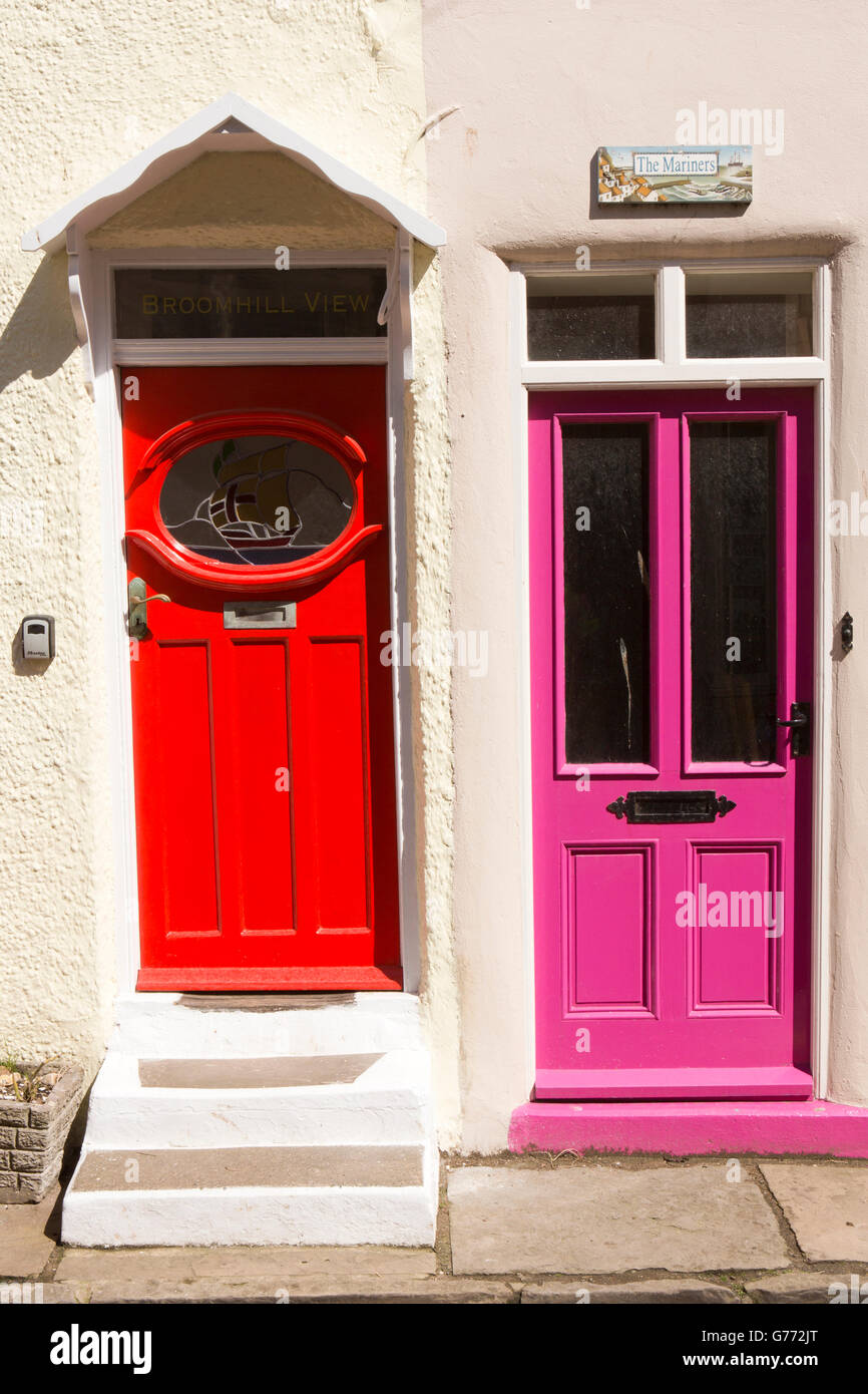 UK, England, Yorkshire, Staithes, High Street, bright red and purple painted doors Stock Photo