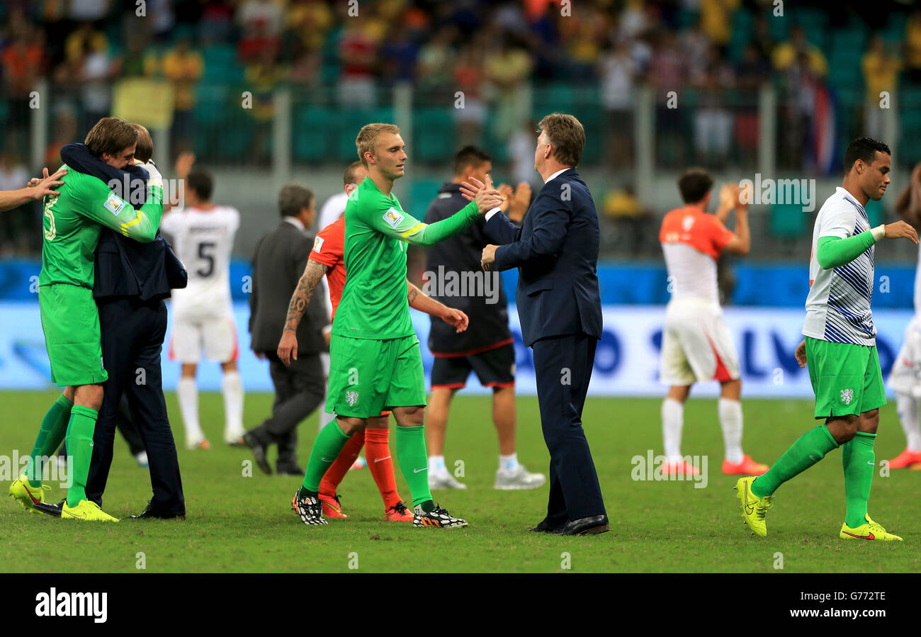 Netherlands goalkeeper Jasper Cillessen shakes hands with manager Louis van Gaal after the penalty shoot-out. Stock Photo