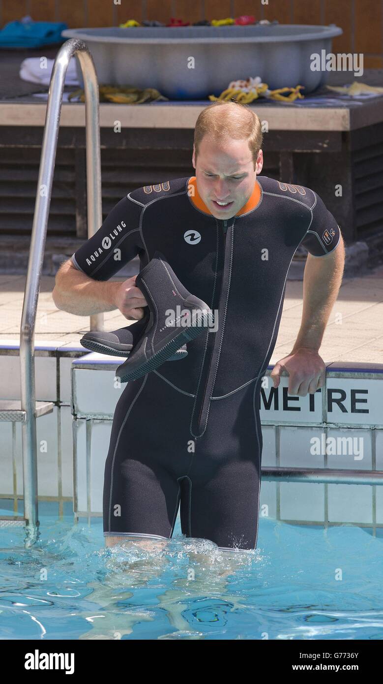 The Duke of Cambridge gets into the water as he prepares to snorkel with British Sub-Aqua Club (BSAC) members at a swimming pool in London. Stock Photo