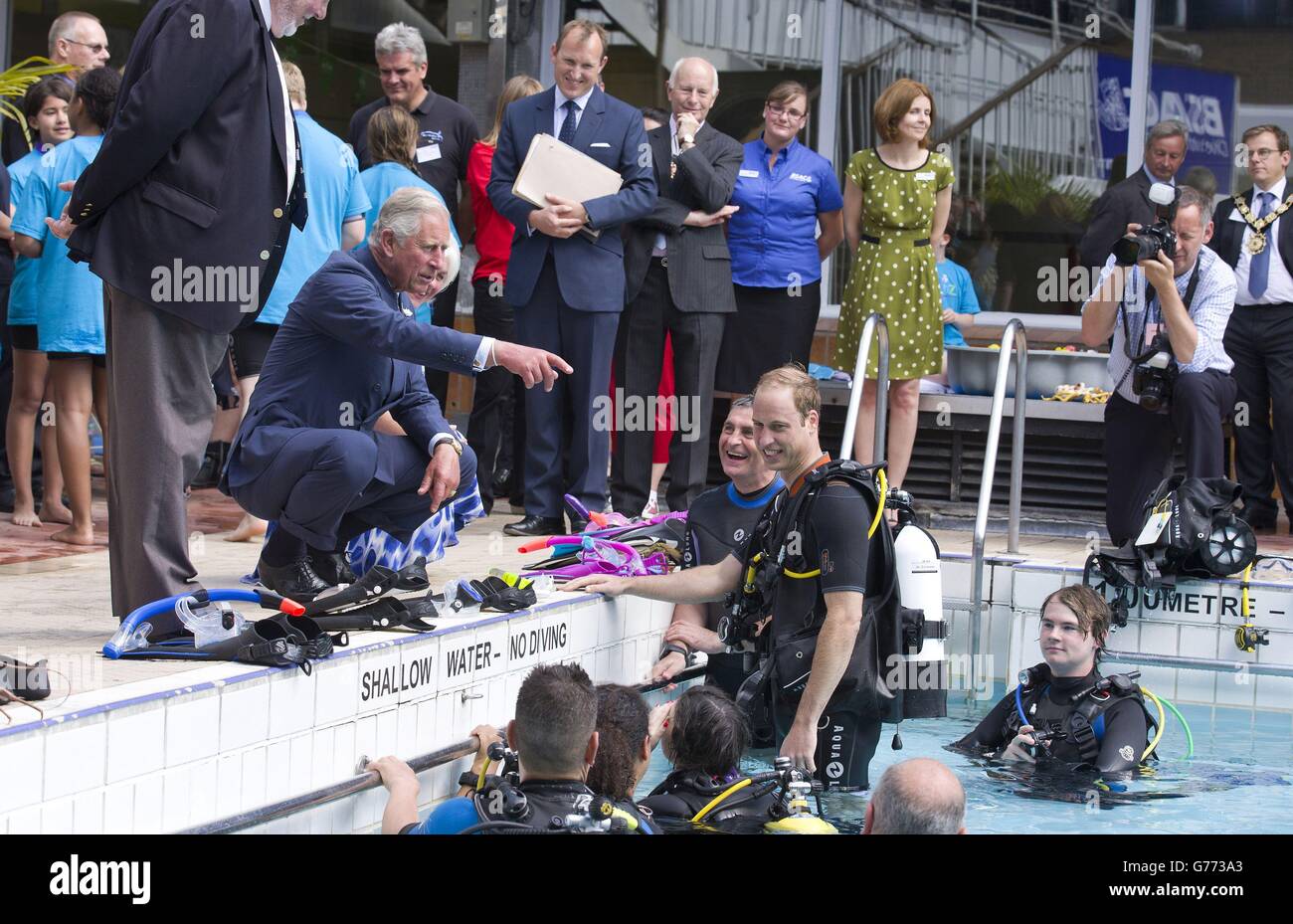 The Prince of Wales speaks with the Duke of Cambrige, as he scuba dives with British Sub-Aqua Club (BSAC) members at a swimming pool in London. Stock Photo