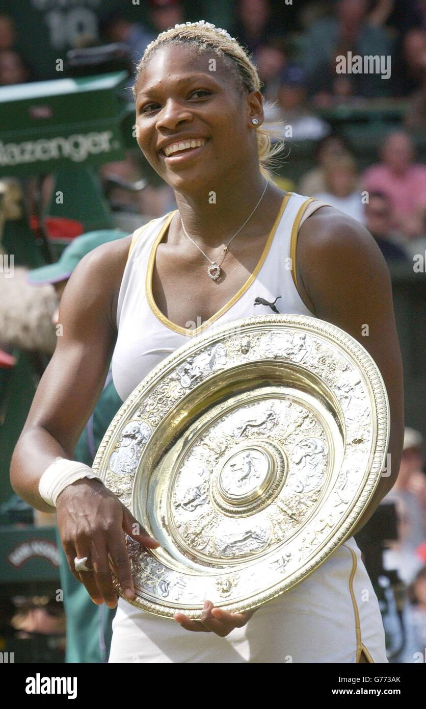EDITORIAL USE ONLY, NO COMMERCIAL USE. Serena Williams from the USA holds her trophy after beating her sister Venus in the Ladies' Singles Final at Wimbledon. It is the first time in 118 years that sisters have met in the final at Wimbledon. Serena triumphed in straight sets 7:6/6:3. 23/3/04: The American star returned to competitive action this week for the first time since the Wimbledon final. Stock Photo