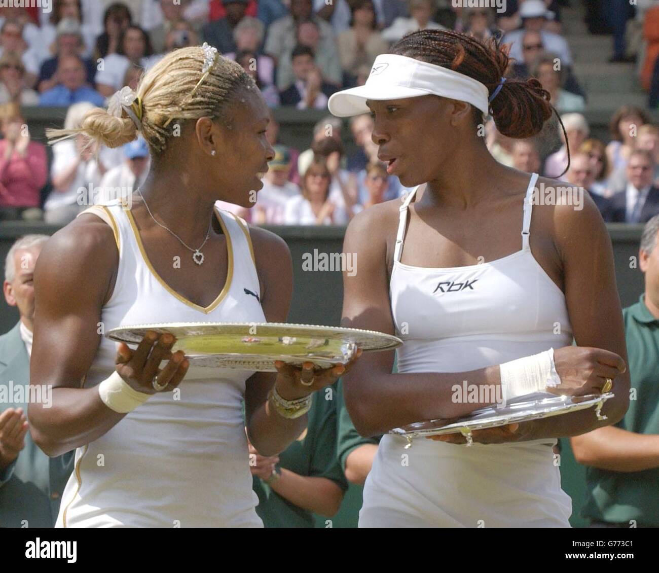 , NO COMMERCIAL USE. Serena Williams (left) from the USA holds her trophy after beating her sister Venus (right) in the Ladies' Singles Final at Wimbledon. It is the first time in 118 years that sisters have met in the final at Wimbledon. * Serena triumphed in straight sets 7:6/6:3. Stock Photo