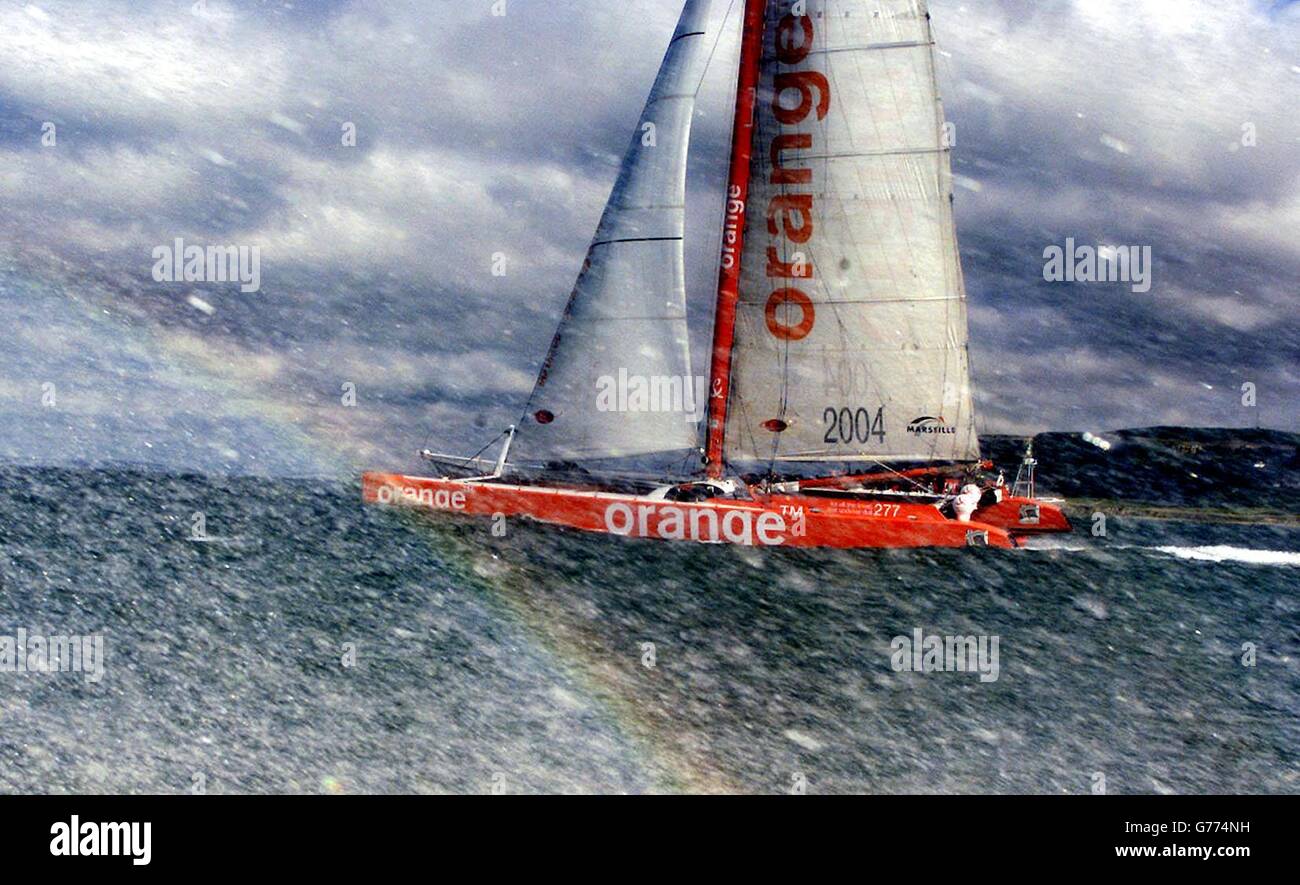 Bruno Peyron S 110ft Maxi Catamaran Orange Flies Out Of The Waters Of The English Channel Off The Isle Of Wight As She Begins Her Attempt To Break The Round Britain And Ireland Record