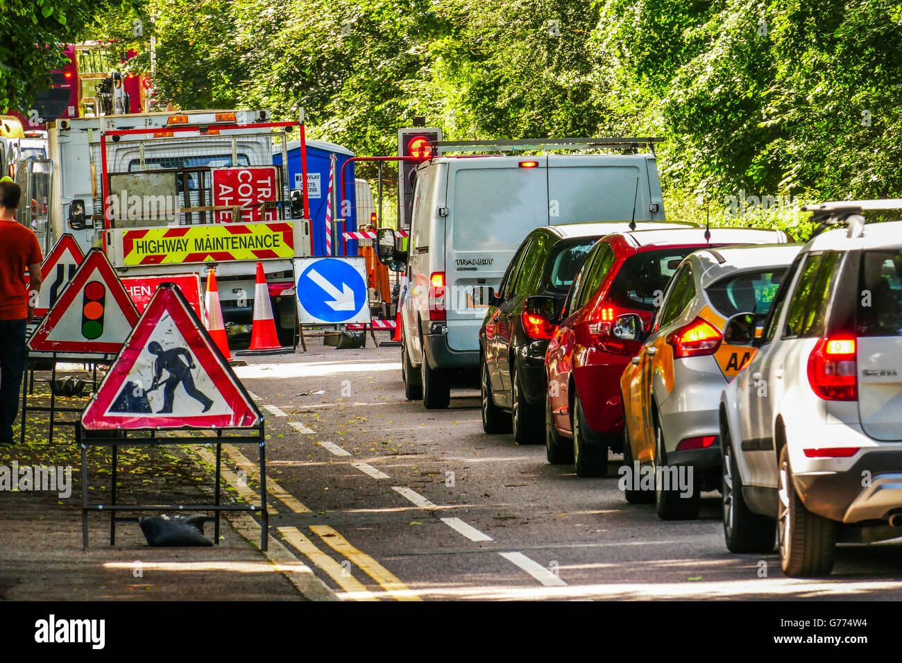 Traffic jam due to temporary traffic lights at roadworks Blake Hall Road, Wanstead, London E11 Stock Photo