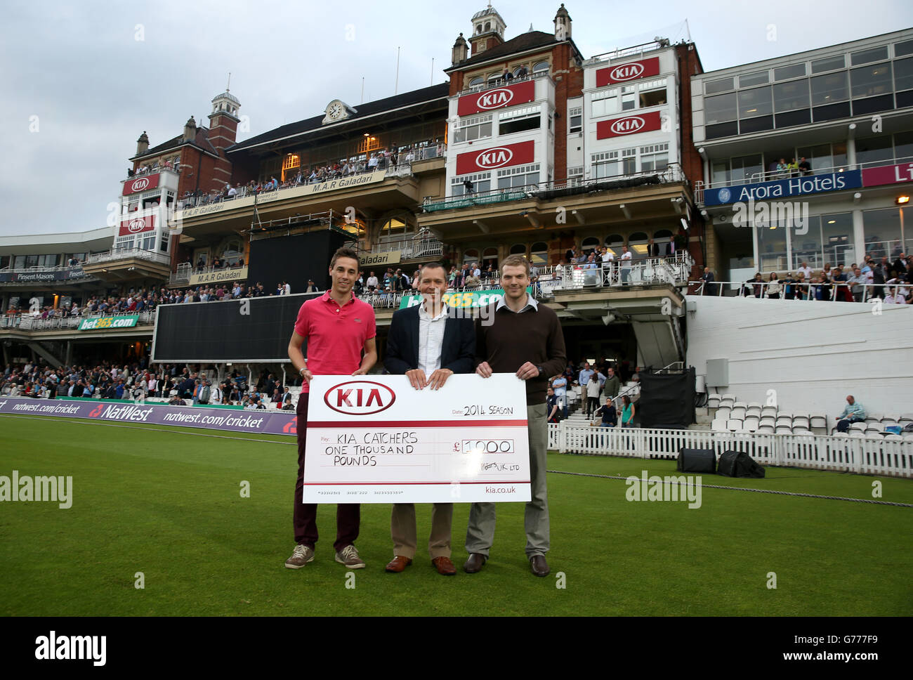 Simon Gardiner, Head of Brand Communications at Kia Motors UK, presents Kia  catchers with their cheques Stock Photo - Alamy