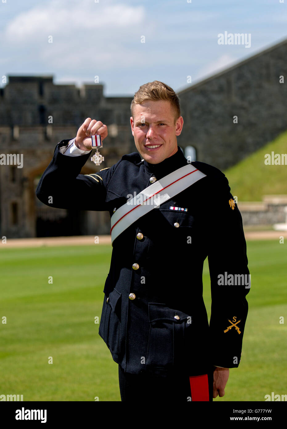 Lance Corporal Simon Maloney with his Conspicuous Gallantry Cross presented to him by Queen Elizabeth II at a Investiture ceremony at Windsor Castle, Windsor. Stock Photo