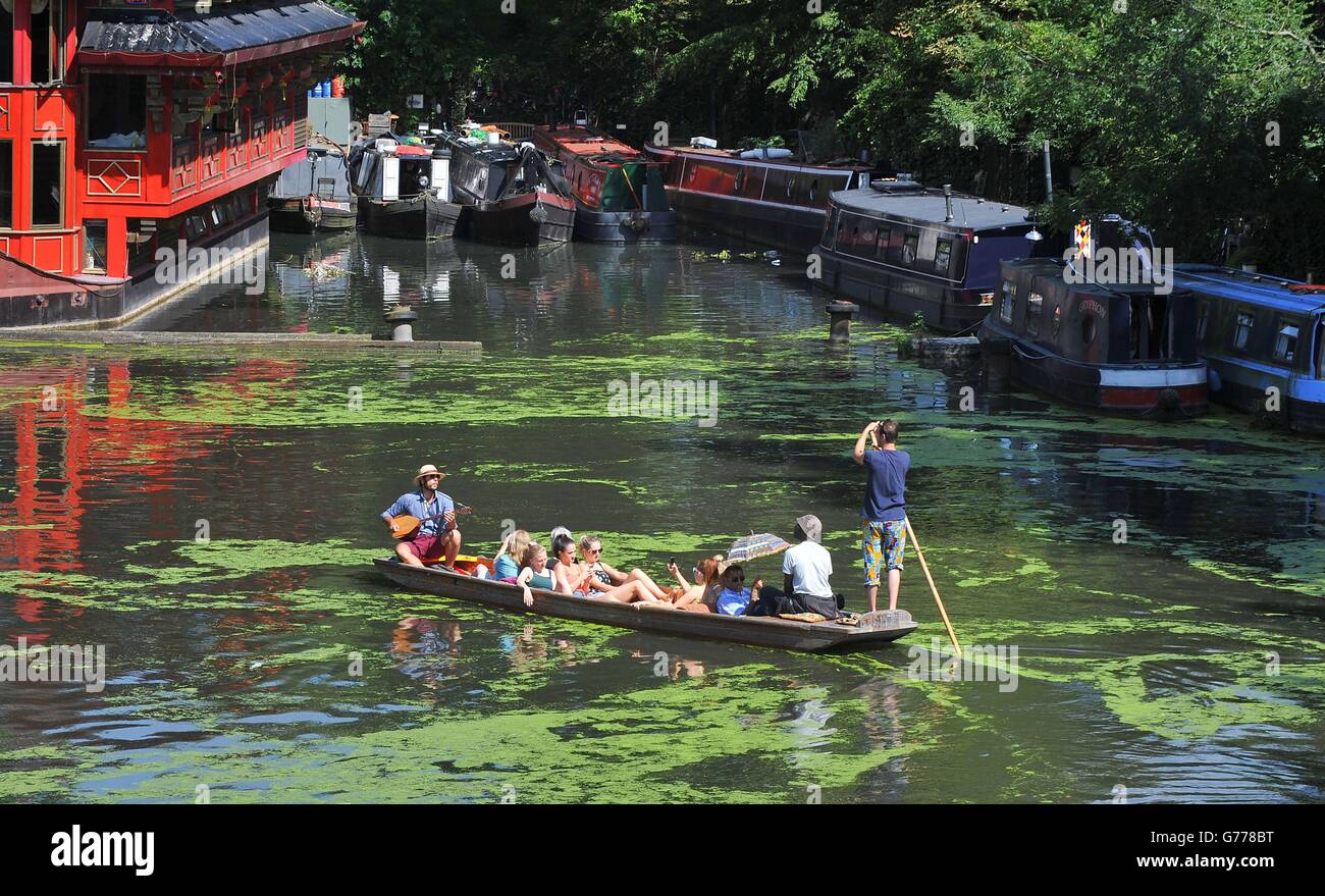 People enjoying the weather in a punt on the Regent's canal in London as temperatures across