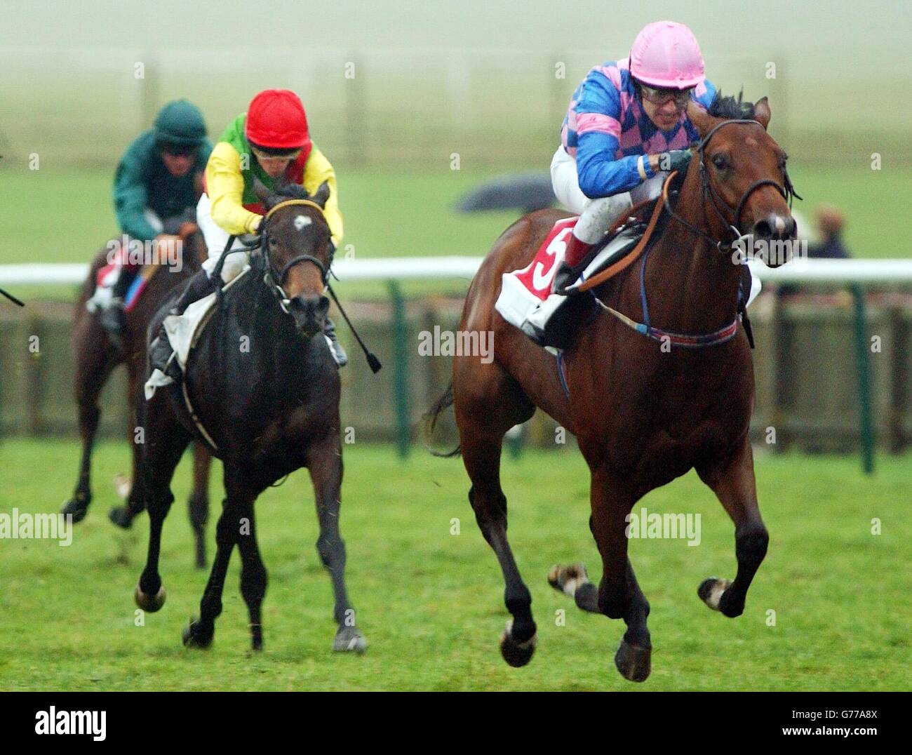 Hanami with jockey Darryl Holland (right), wins the Montrose Fillies' Stakes at Newmarket Race Course, Newmarket. Stock Photo