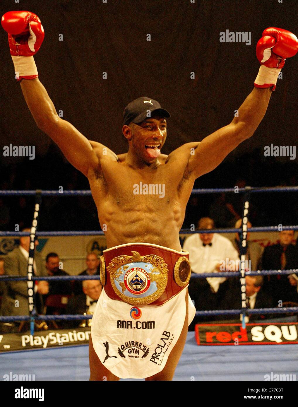 Johnny Nelson celebrates as he wins a split decision on the three