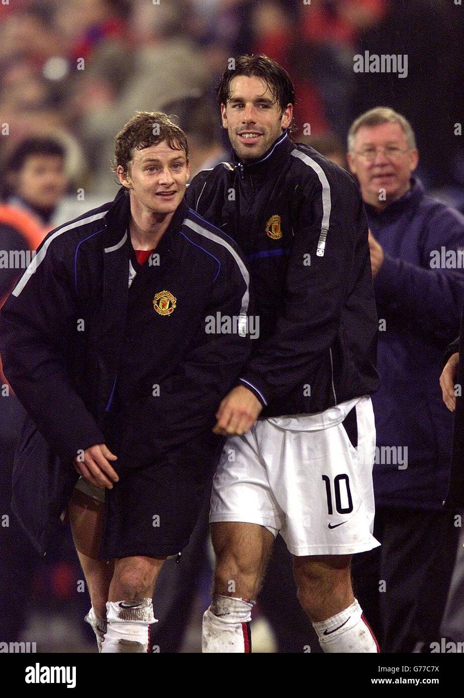 United goal scorers Ole Gunnar Solskjaer (left) and Ruud van Nistelrooy celebrate their 3.1 defeat of Basle in the Champions League second round Group D match at Saint Jakob's stadium, Switzerland. NO WEBSITE/INTERNET USE UNLESS SITE IS REGISTERED WITH FOOTBALL ASSOCIATION PREMIER LEAGUE Stock Photo
