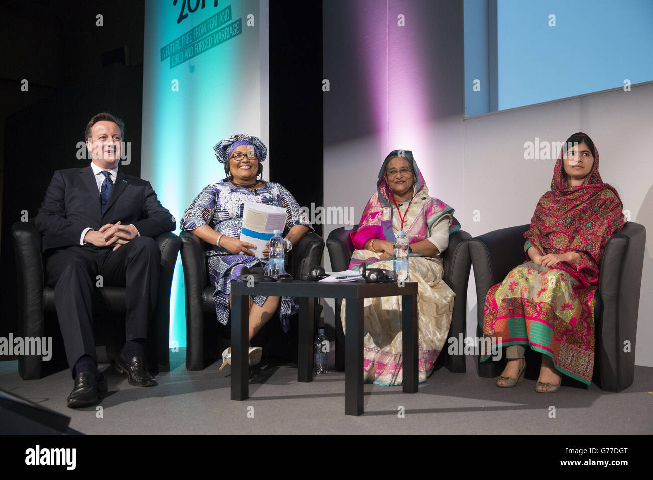 (Left - right) Prime Minister David Cameron, Chantal Compaore the First Lady of Burkina Faso, Sheikh Hasina the Prime Minister of Bangladesh and activist Malala Yousafzai during the Girl Summit 2014 at Walworth Academy, London, where Mr Cameron announced parents who fail to prevent their daughter being subjected to female genital mutilation (FGM) will face prosecution under new legislation. Stock Photo