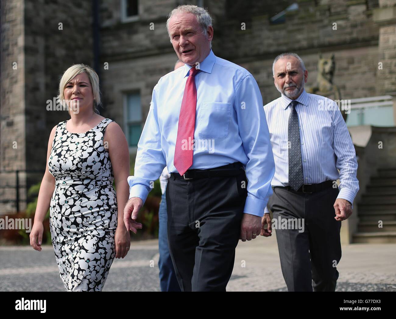 (Left to right) Sinn Fein's Michelle O'Neill, Martin McGuinness and Sean Murray at Stormont Castle after meeting Northern Ireland Secretary Theresa Villiers. Stock Photo