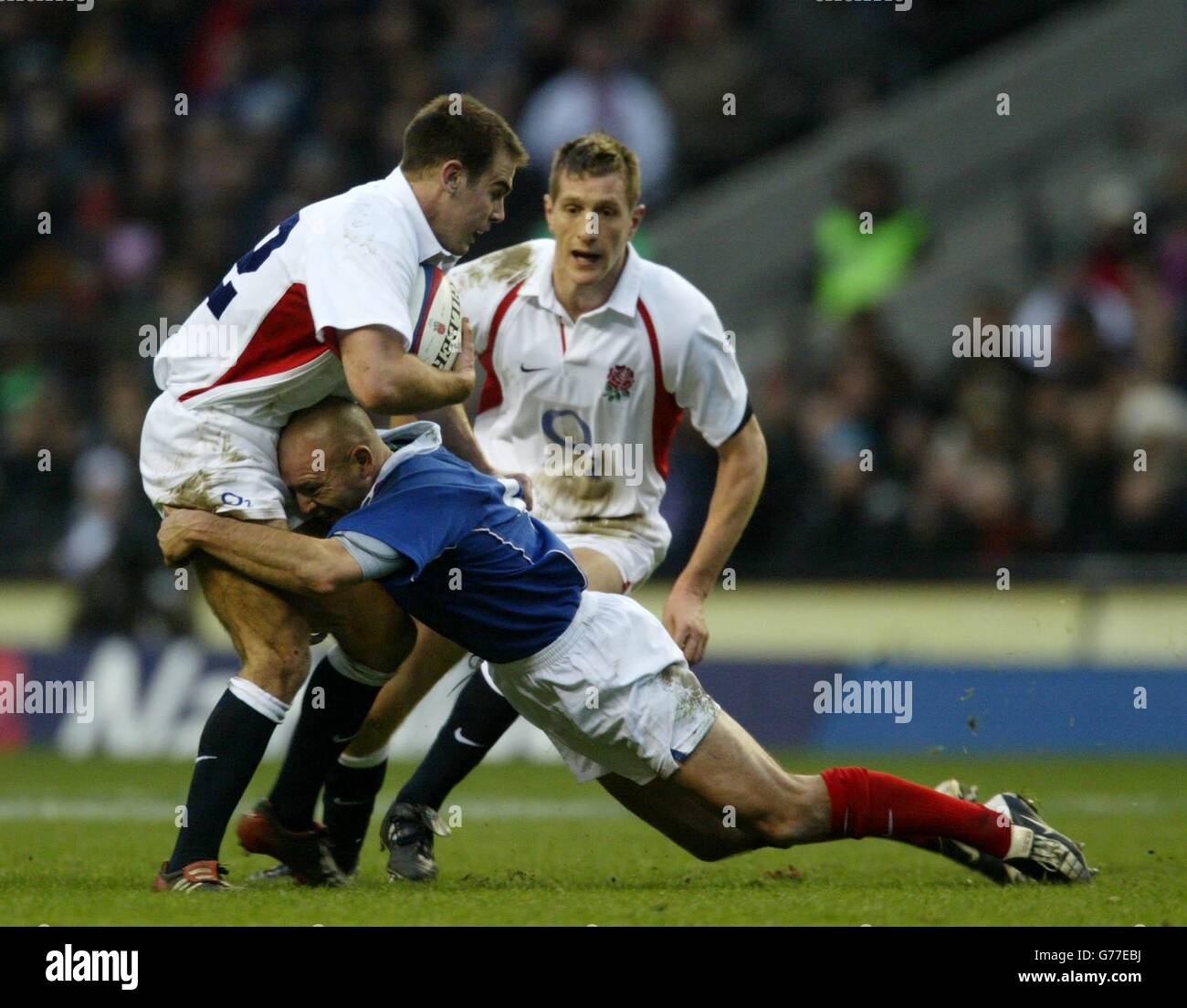 England's Charlie Hodgson is caught by French Gerald Merceron as England's Will Greenwood looks on, during RBS 6 Nations game England v France at Twickenham, London. Stock Photo