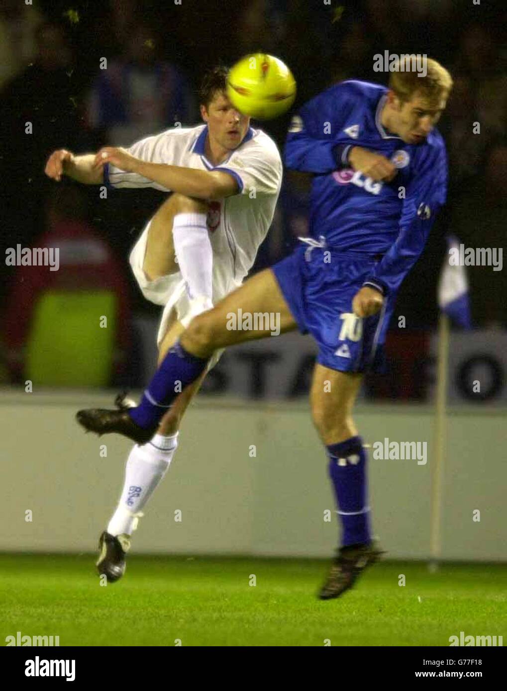 Leicester's James Scowcroft avoids Portsmouth's Arjan De Zeeuw, during the Nationwide League Division One game at the Walkers Stadium, Leicester. NO UNOFFICIAL CLUB WEBSITE USE. Stock Photo