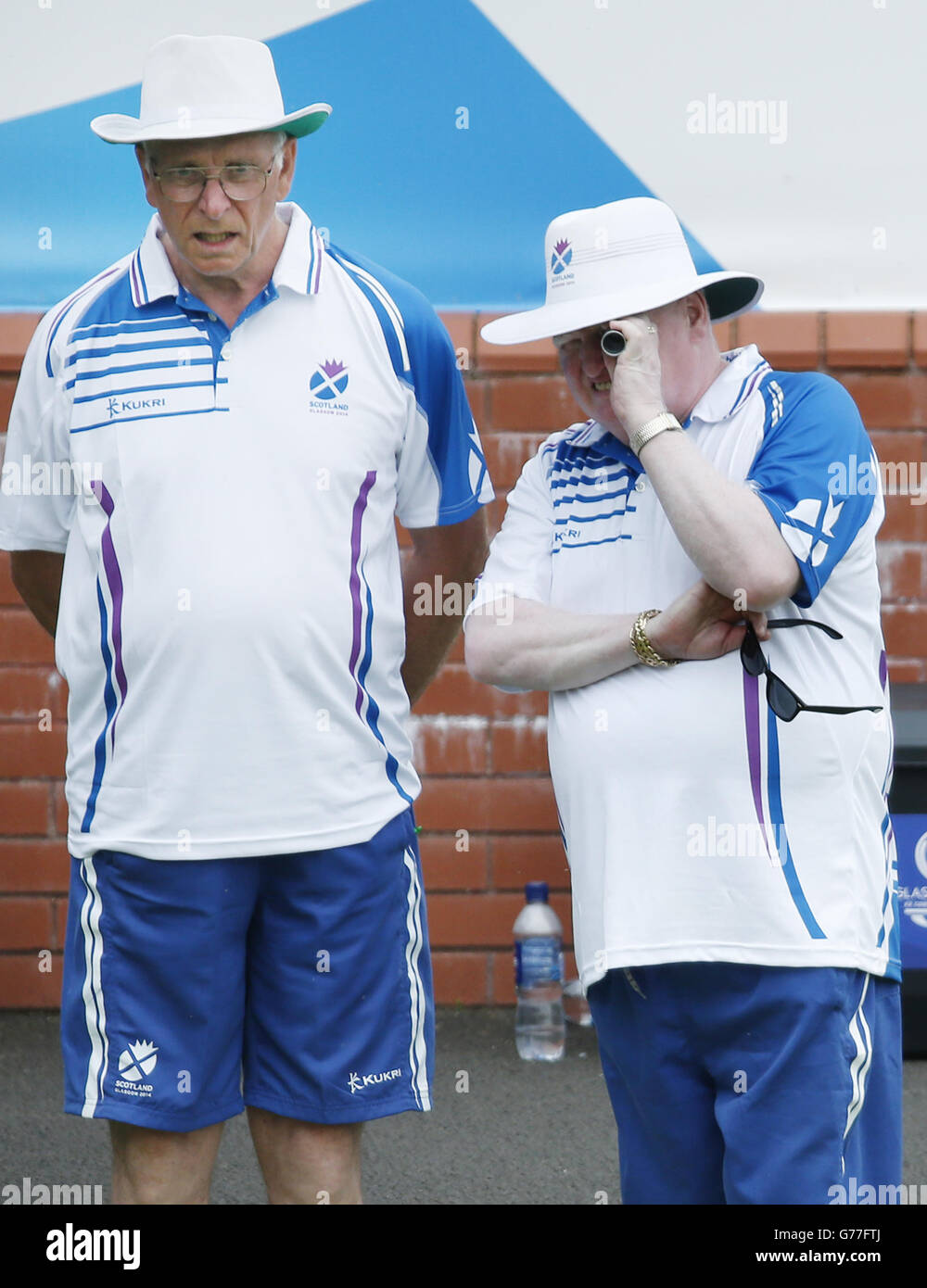 England's Robert Conway (right) an Ron McArthur (left) during the Para-Sports Mixed Pairs at Kelvingrove Lawn Bowls Centre during the 2014 Commonwealth Games in Glasgow, Scotland. Stock Photo
