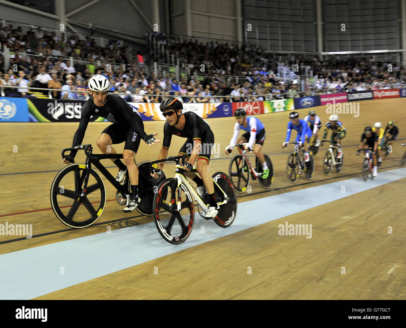 New Zealand rider Shane Archbold(left) argues with isle of Man rider Joseph Kelly after Kelly was pulled out of the race by the judges at the Sir Chris Hoy Velodrome during the 2014 Commonwealth Games in Glasgow. Stock Photo
