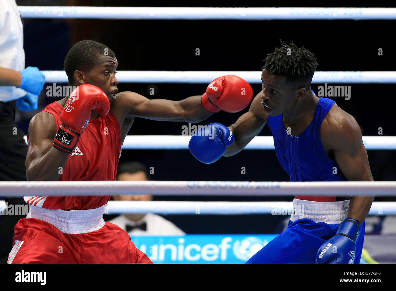 Zambia's Charles Lumbwe in action against Mozambique's Bernado Marrime (right) in the Men's Light Welter round of 32 match at the SECC during the 2014 Commonwealth Games in Glasgow. Stock Photo