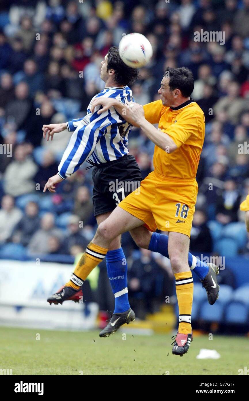 Michael Reddy Football Michael Reddy (left) of Sheffield Wednesday jumps for the Ball with ...