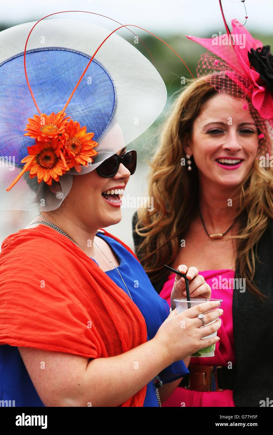 Sisters Kristine Koffey, from Athenry, left, and her sister Alison Koffey, who is returning home from Brisbane, Australia, for the first time in 4 years, on day one of the Galway Festival at Galway Racecourse, Ireland. Stock Photo