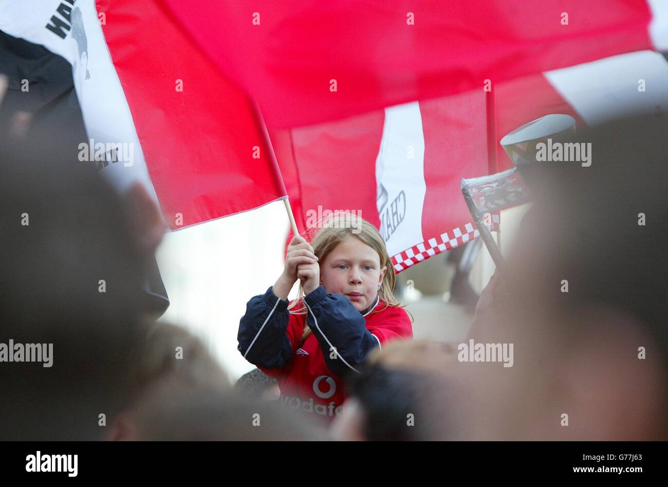 Manchester United fan Zoe Perry celebrates her team winning the Barclaycard Premiership title, at Old Trafford, Manchester, after arch rivals Leeds United had earlier defeated Arsenal at Highbury. Stock Photo