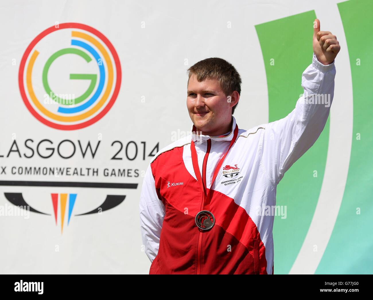 England's Kristian Callaghan celebrates his bronze medal in the 25m Rapid Fire Pistol Men at Barry Budden Shooting Centre, during the 2014 Commonwealth Games in Carnoustie. Stock Photo